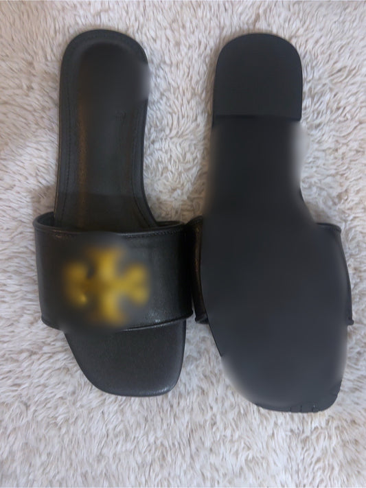 Tb black and gold sandals