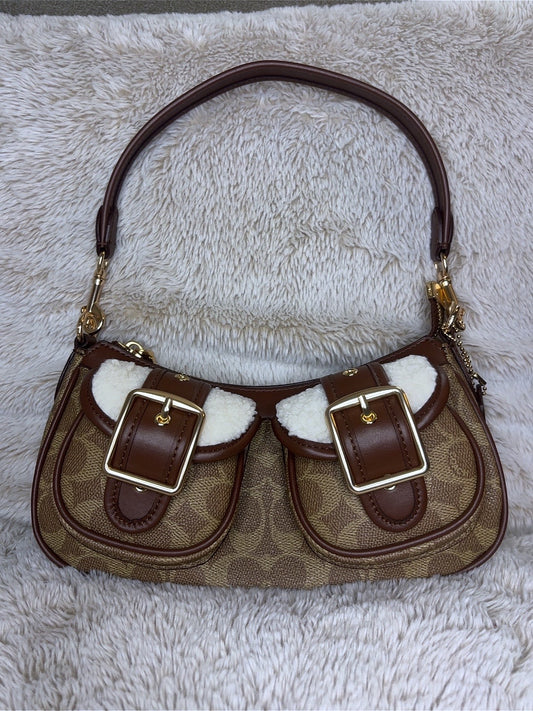 C brown bag with white fur